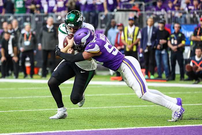 New York Jets quarterback Mike White (5) is tackled by Minnesota Vikings linebacker Jordan Hicks (58). Mandatory Credit: Matt Krohn-USA TODAY Sports